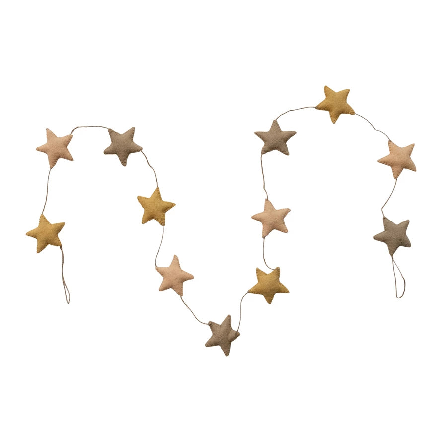 String of beige and gold star-shaped decorations on a white background