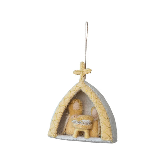 Decorative nativity scene ornament on a white background