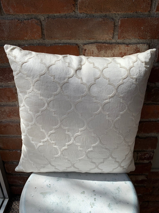 Elegantly embroidered white on white pillow