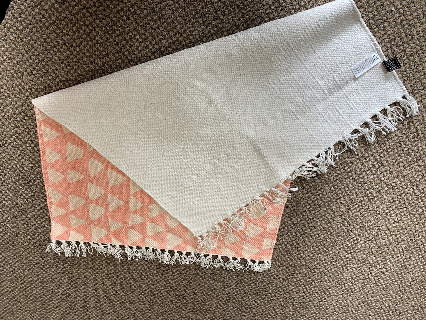 2 x 3 Pink rug with white triangles.  White Tasseled Ends