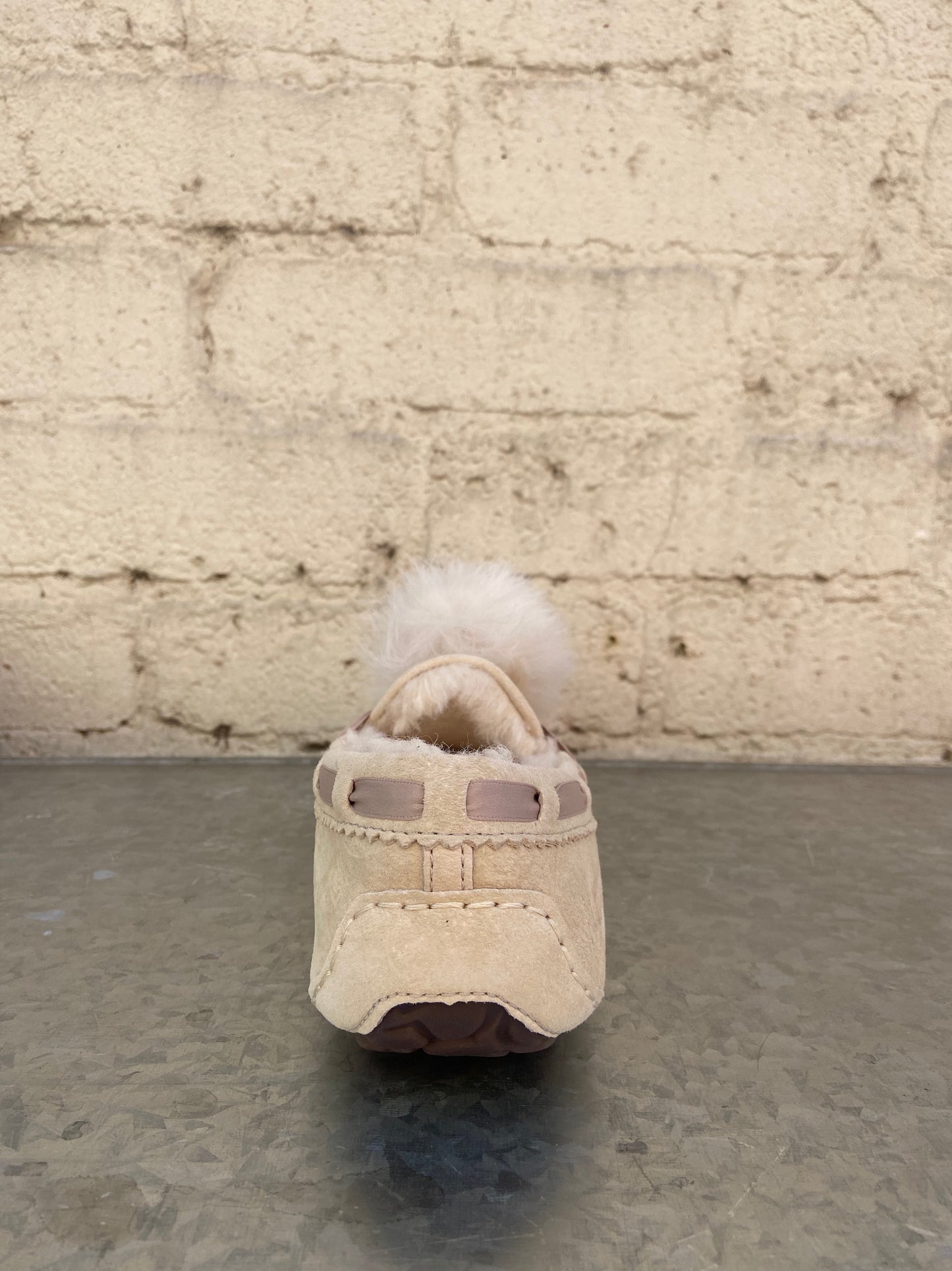 Cream with Dusty Pink accents 100% Suede Dyed Sheep, Fur Origin: United States/United Kingdom/Spain/Ireland/Australia Rubber sole Indoor/ Outdoor Water Resistant Sheepskin pom pom  17MM UGGpure wool lining 17MM UGGpure wool insole