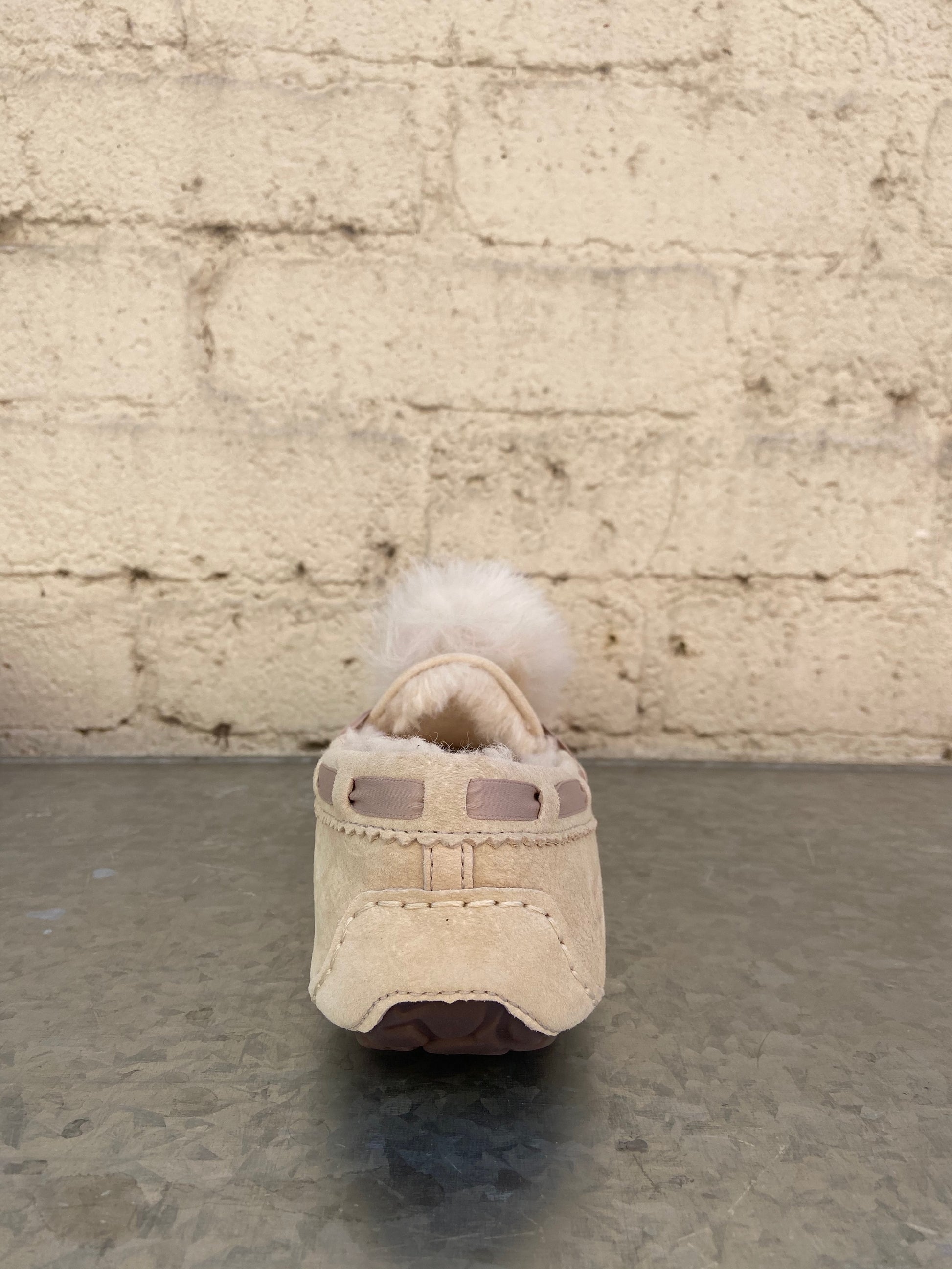Cream with Dusty Pink accents 100% Suede Dyed Sheep, Fur Origin: United States/United Kingdom/Spain/Ireland/Australia Rubber sole Indoor/ Outdoor Water Resistant Sheepskin pom pom  17MM UGGpure wool lining 17MM UGGpure wool insole
