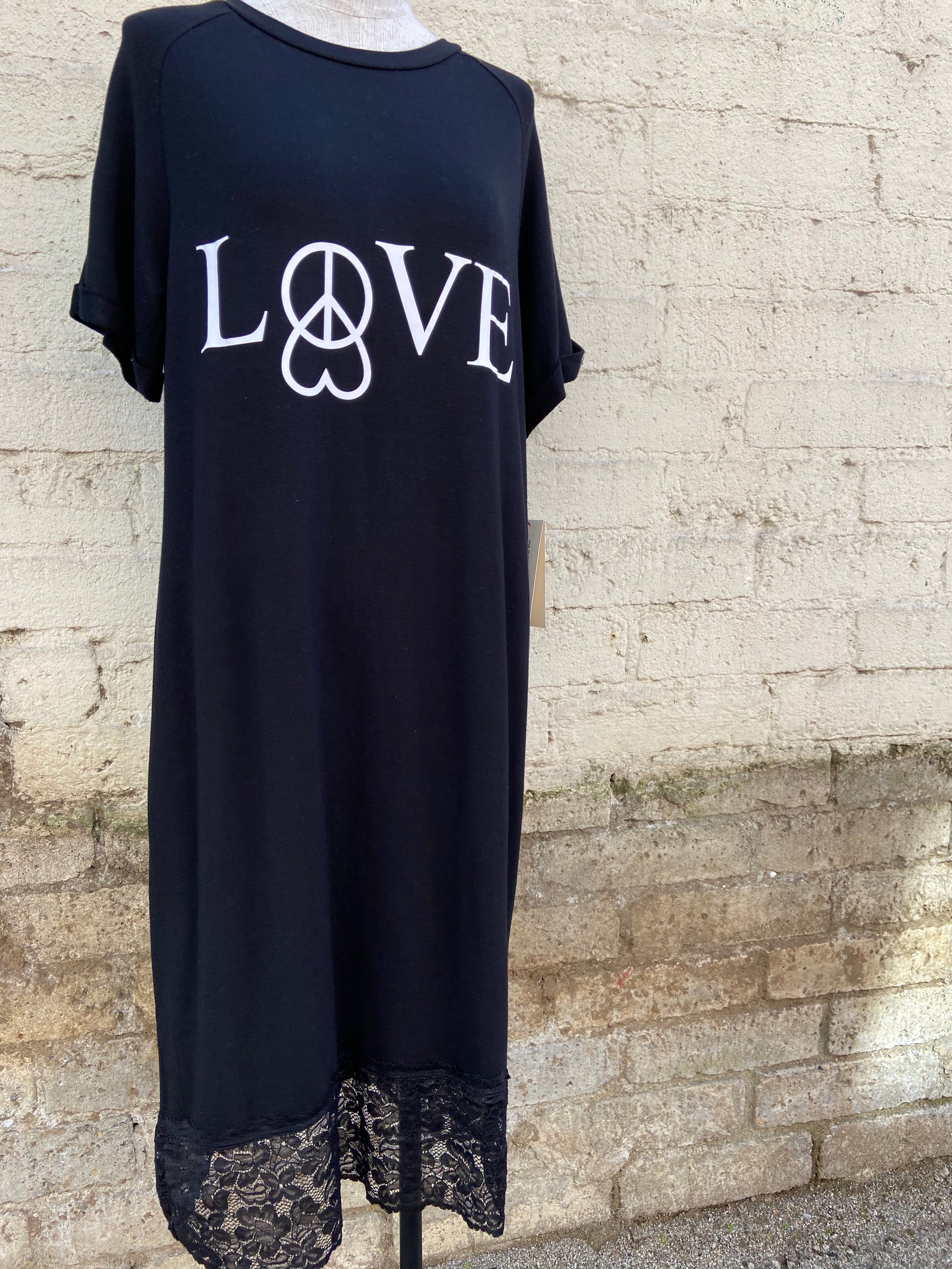 Extremely comfortable, black, short sleeved nightgown. It has a lovely lace trim at the bottom, and a graphic that reads "Love" with a heart and peace sign.