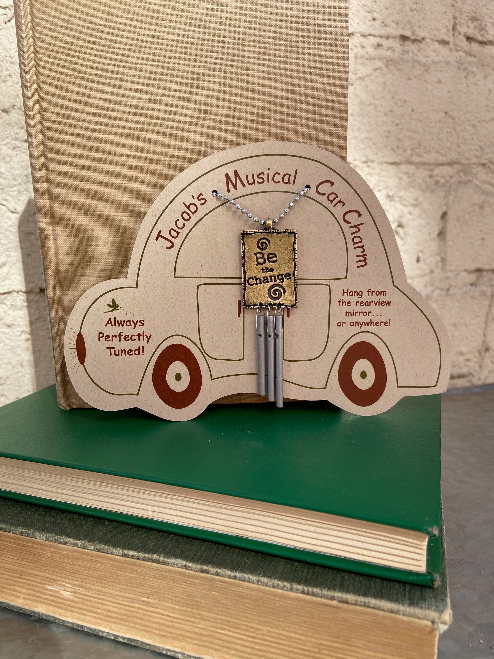 Musical Car Charms will soothe and relax as you navigate the busy highways of life. Cast metal charm is etched on both sides and finished in antique brass. Relaxing and pleasing sound from three perfectly tuned aluminum pipes. Musical instrument and chime maker Jacob Sokoloff hand tunes these car chimes to produce a musical sound guaranteed to make you smile. Dimensions: 3 inches tall plus 9 inch ball chain.