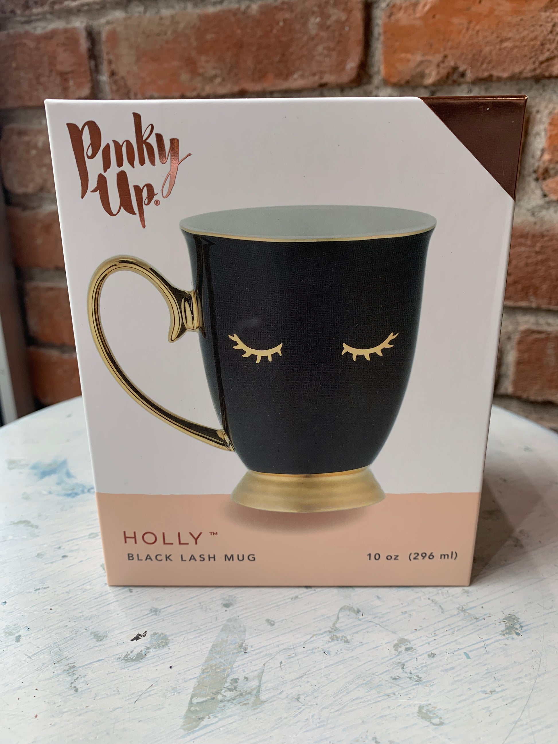 Black mug with gold accents. Will hold 10 oz. of your favorite beverage!