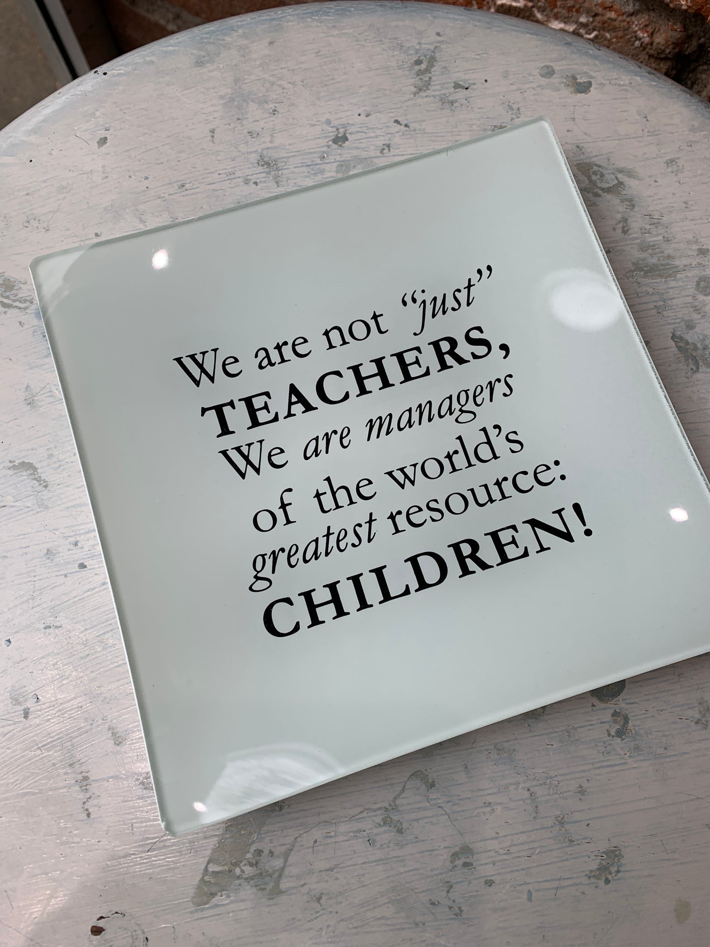 Tell a teacher how much you appreciate their dedication and hard work with this decorative plate that celebrates one of our noblest professions. The thoughtful quote embellishing this 6-inch-square plate reminds them of their meaningful impact. Perfect for holding jewelry, coins or other small trinkets or to display on a desk. Makes a great end-of-the-year gift for your child's teacher or treat a teacher-friend with this tribute. On plate: We are not "just" teachers, we are managers of the world's greatest 