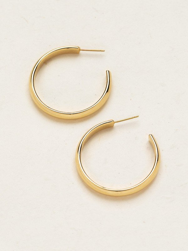 Holly Yashi Cara Hoop Post Earrings. Fiercely fashionable without the fuss, there’s no situation that a great pair of classic hoops can’t handle! The sophisticated satin finish of our Cara Small Post Hoop Earrings provide you with that perfect touch of shine to frame your face and set off that sparkle in your eyes.