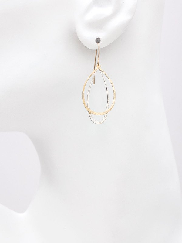 Holly Yashi In The Loop Earrings. Our In the Loop Earrings feature two metallic drop hoops in modern silhouettes. Light and ultra-thin, these drop earrings make a statement without adding any weight. Whether styled for day or night, these earrings are sure to turn heads.