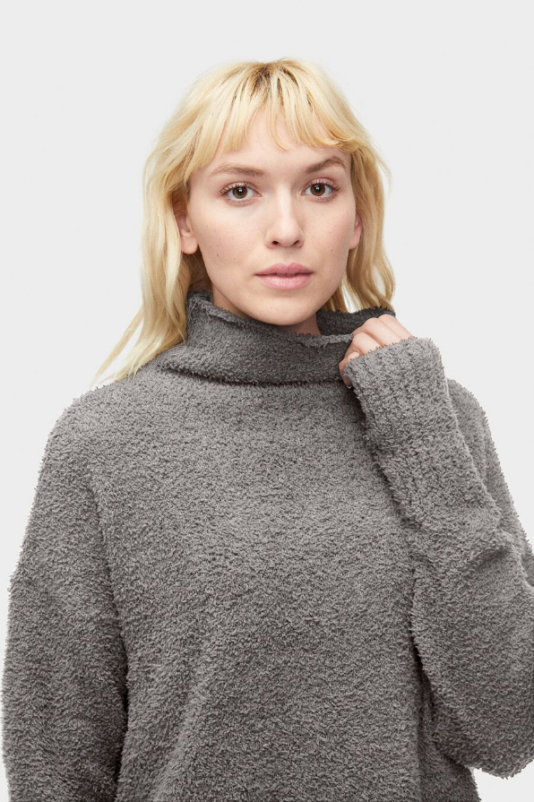 UGG Sage Sweater. A cozy turtleneck with an understated aesthetic, our Sage sweater is a staple piece for any winter wardrobe. Pair it with elevated skirts and trousers for a night on the town, or wear around the house with your favorite sweatpants.